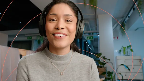 Smiling professional looking at the camera and wearing a headset